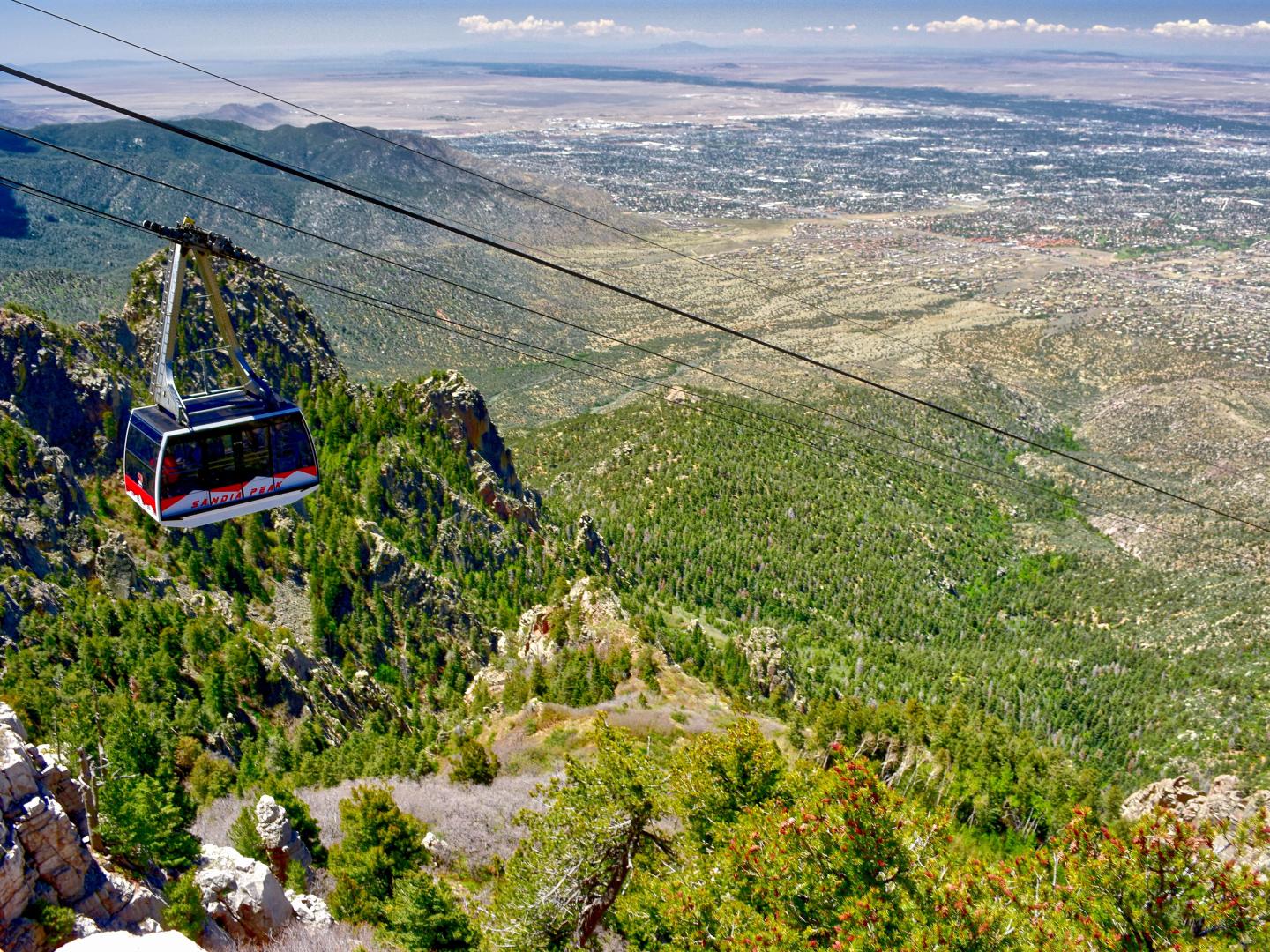 The Sandia Peak Aerial Tramway rises above Albuquerque, New Mexico The Sandia Peak Aerial Tramway rises above Albuquerque, New Mexico