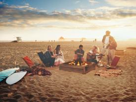Bonfire on the beach at sunset in Huntington Beach, California