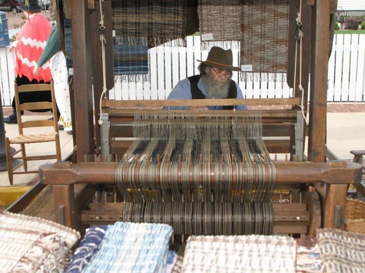 Working the loom at the Folklife Festival Working the loom at the Folklife Festival