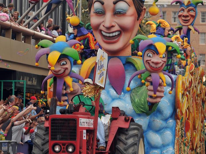 A colorful Mardi Gras float parades through the street in New Orleans, Louisiana A colorful Mardi Gras float parades through the street in New Orleans, Louisiana