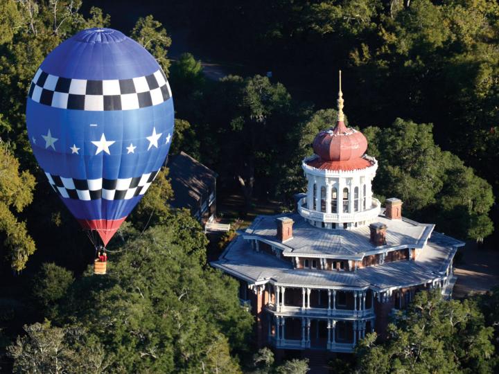 A hot air balloon floating over Longwood mansion in Natchez, Mississippi