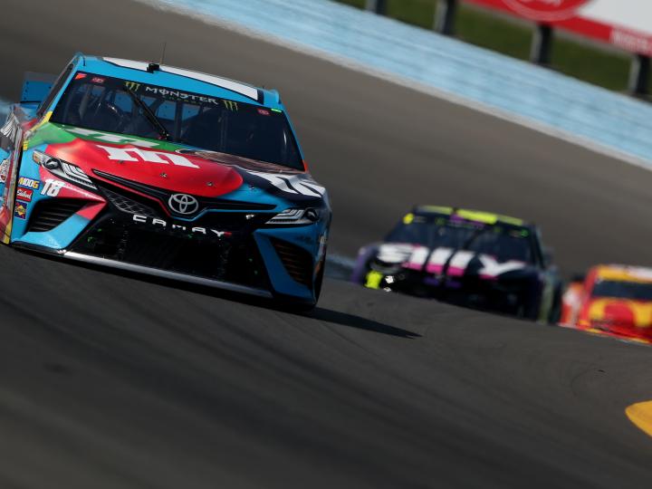 Stock cars compete at the Go Bowling at the Glen NASCAR Race in Watkins Glen, New York Stock cars compete at the Go Bowling at the Glen NASCAR Race in Watkins Glen, New York