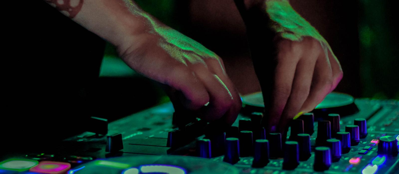 A DJ performs an EDM set A DJ performs an EDM set
