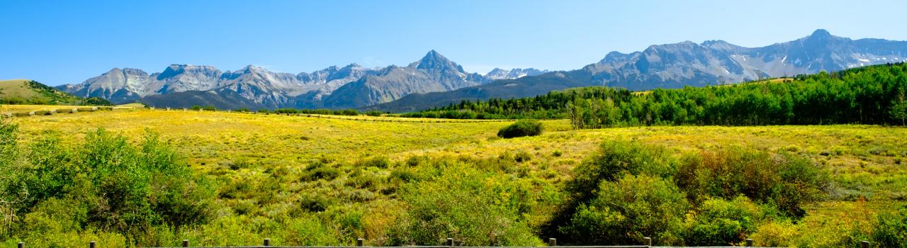 Scenic pasture with a view of mountains near Aspen, Colorado Scenic pasture with a view of mountains near Aspen, Colorado