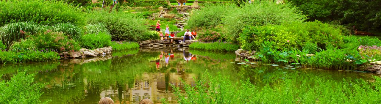 People relaxing by the water at Philbrook Museum Gardens in Tulsa People relaxing by the water at Philbrook Museum Gardens in Tulsa