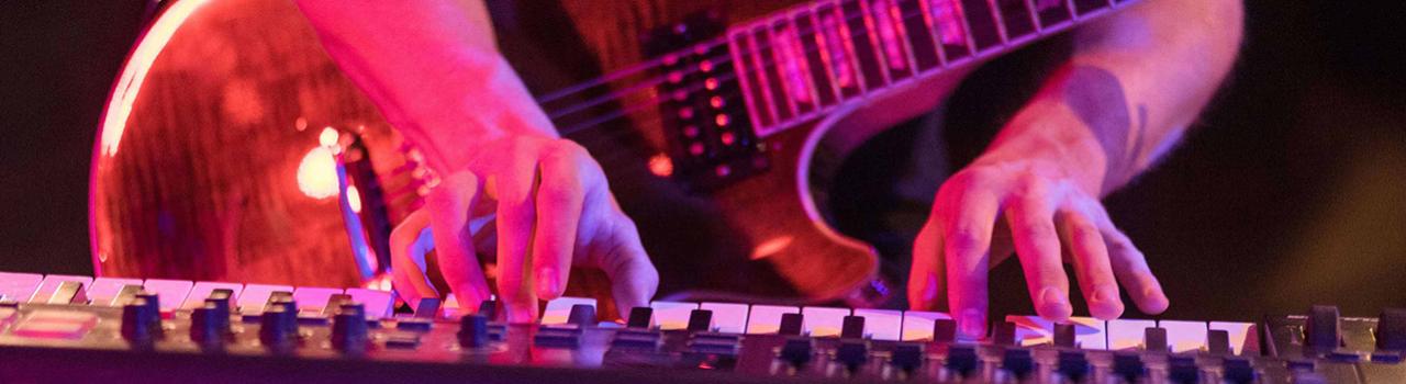 Playing the keyboard during an EDM show Playing the keyboard during an EDM show