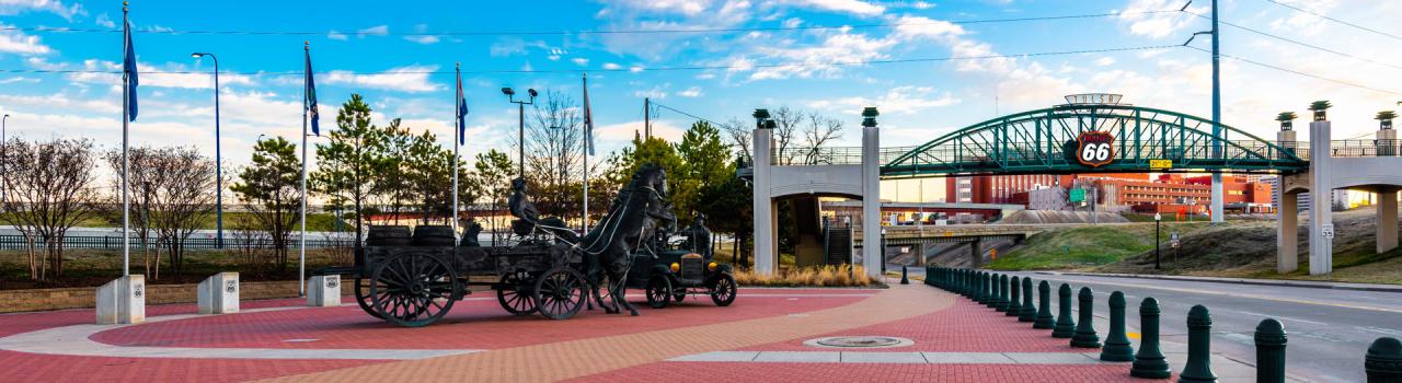 The East Meets West Symbolic Route 66 Midpoint at Cyrus Avery Centennial Plaza in Tulsa, Oklahoma The East Meets West Symbolic Route 66 Midpoint at Cyrus Avery Centennial Plaza in Tulsa, Oklahoma