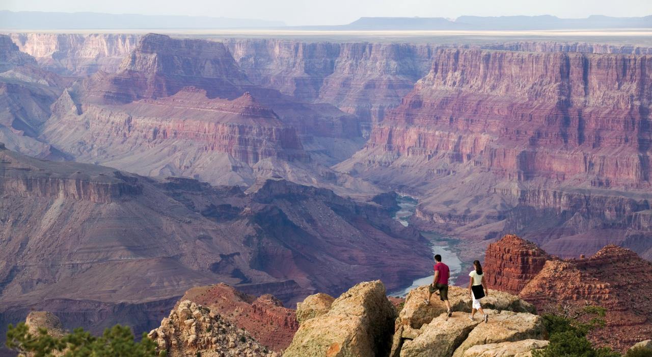 Standing at the edge of the Grand Canyon Standing at the edge of the Grand Canyon