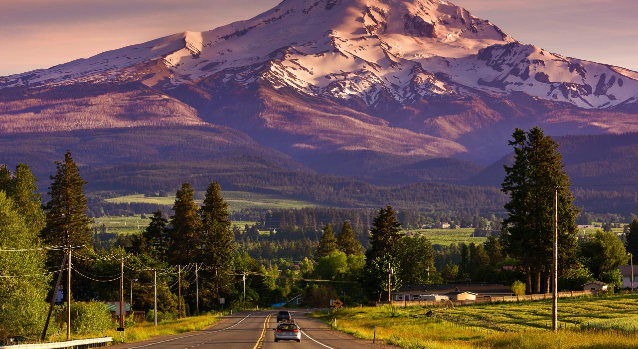 Scenic drive in front of a snow-covered mountain Scenic drive in front of a snow-covered mountain