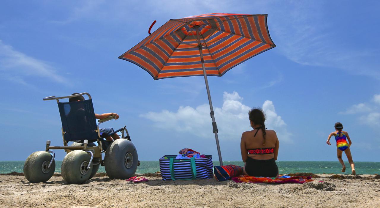 Family enjoying a fun day at the beach in stunning Key Biscayne, Florida Family enjoying a fun day at the beach in stunning Key Biscayne, Florida