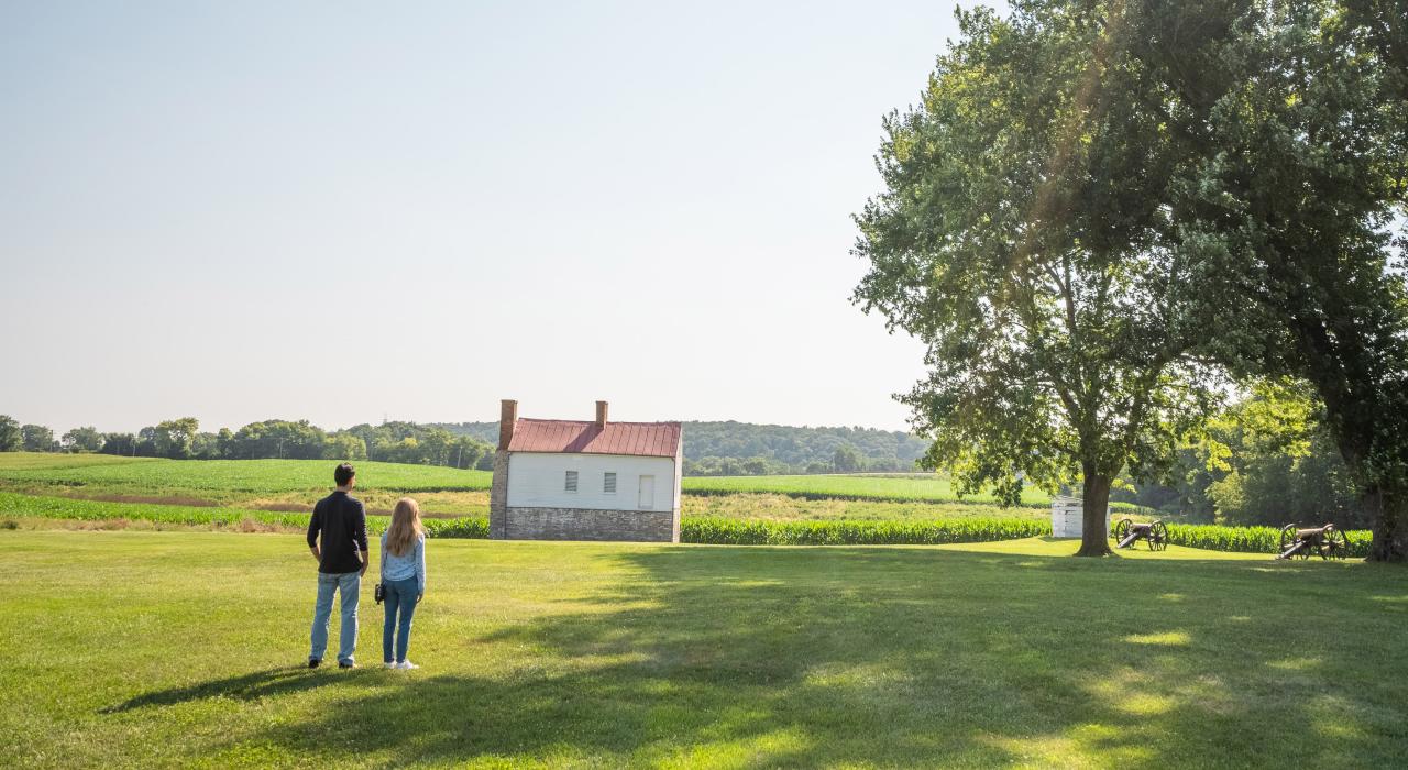 Couple viewing historic sites at Monocacy National Battlefield in Frederick, Maryland Couple viewing historic sites at Monocacy National Battlefield in Frederick, Maryland