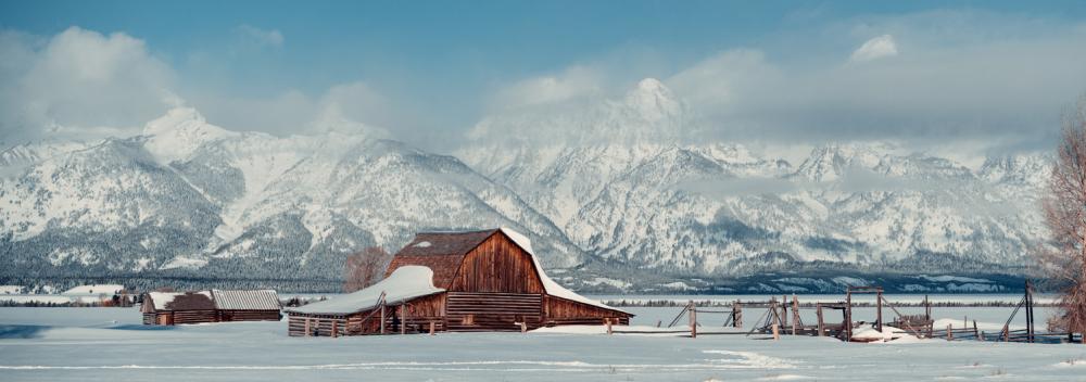 Snowy Wyoming farm with the Grand Tetons in the background