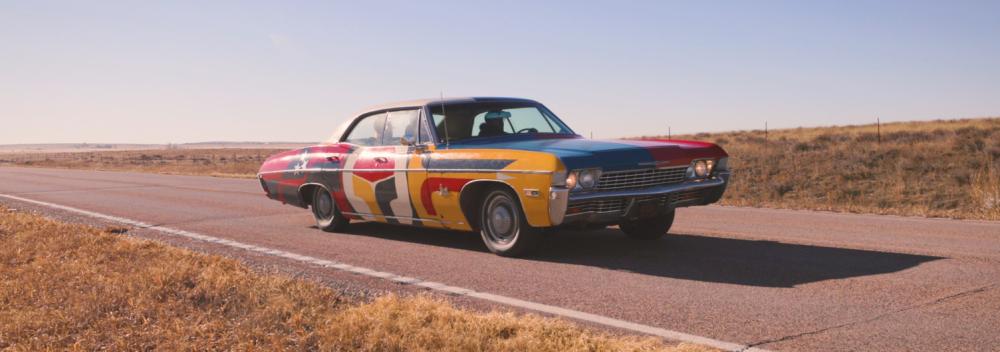 The United Stories mobile studio car on the road in South Dakota