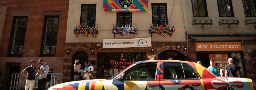 The United Stories Studio car in front of the historic Stonewall Inn, where 1969 riots launched the gay rights movement