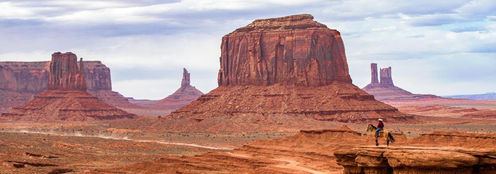Horseback rider overlooking Monument Valley, Utah